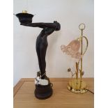 A black resin table lamp in the form of an Art Deco ball girl, lacking shade, height 54 cm and