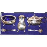 A silver three piece cruet set by Walker and Hall, London 1936 of baluster form, with gadrooned