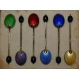 A set of six silver gilt and enamel coffee bean spoons, Birmingham 1932 with guilloche enamel