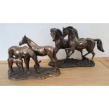 Two bronze effect resin horse groups (2).