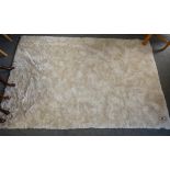 An off-white rug 240x155cm