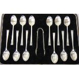 An Art Deco silver set of twelve tea spoons and tongs, by Cooper Bros., Sheffield 1939, with