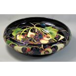 A large Moorcroft Prestige 'Queens Choice' pattern tube line decorated bowl, signed 'E. Bossons'