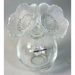 A Lalique frosted and moulded glass scent bottle and stopper, the oversized stopper formed of two