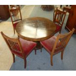 A Regency rosewood circular tilt top dining table, raised on an octagonal baluster pedestal to a