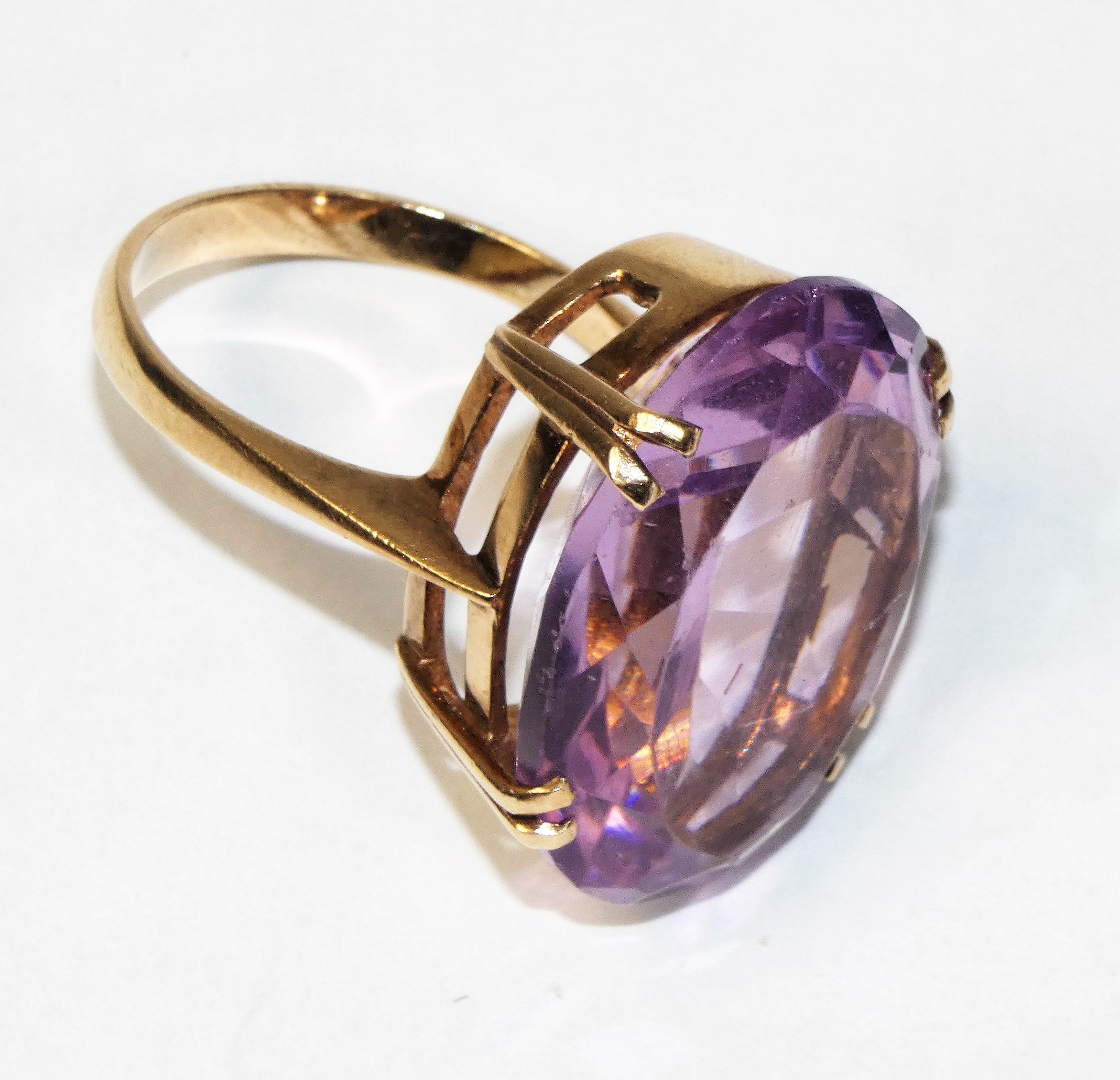 A 9ct rose gold mounted amethyst ring, four claw set with on oval mixed cut stone, 25 x 20 mm, - Image 2 of 2