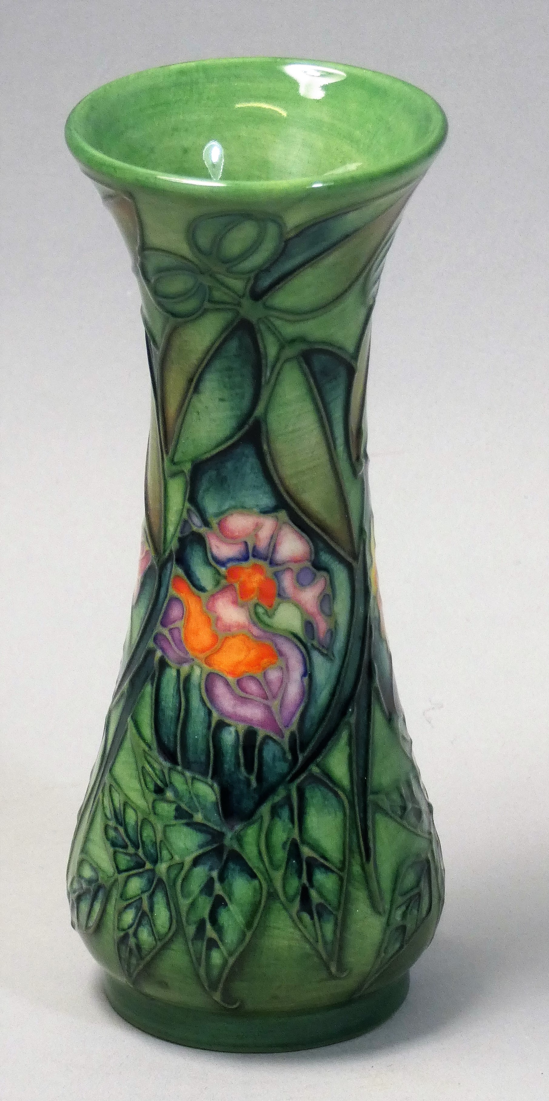 A miniature Moorcroft 'Rain Forest' pattern tube line decorated vase of trumpet form, decorated with