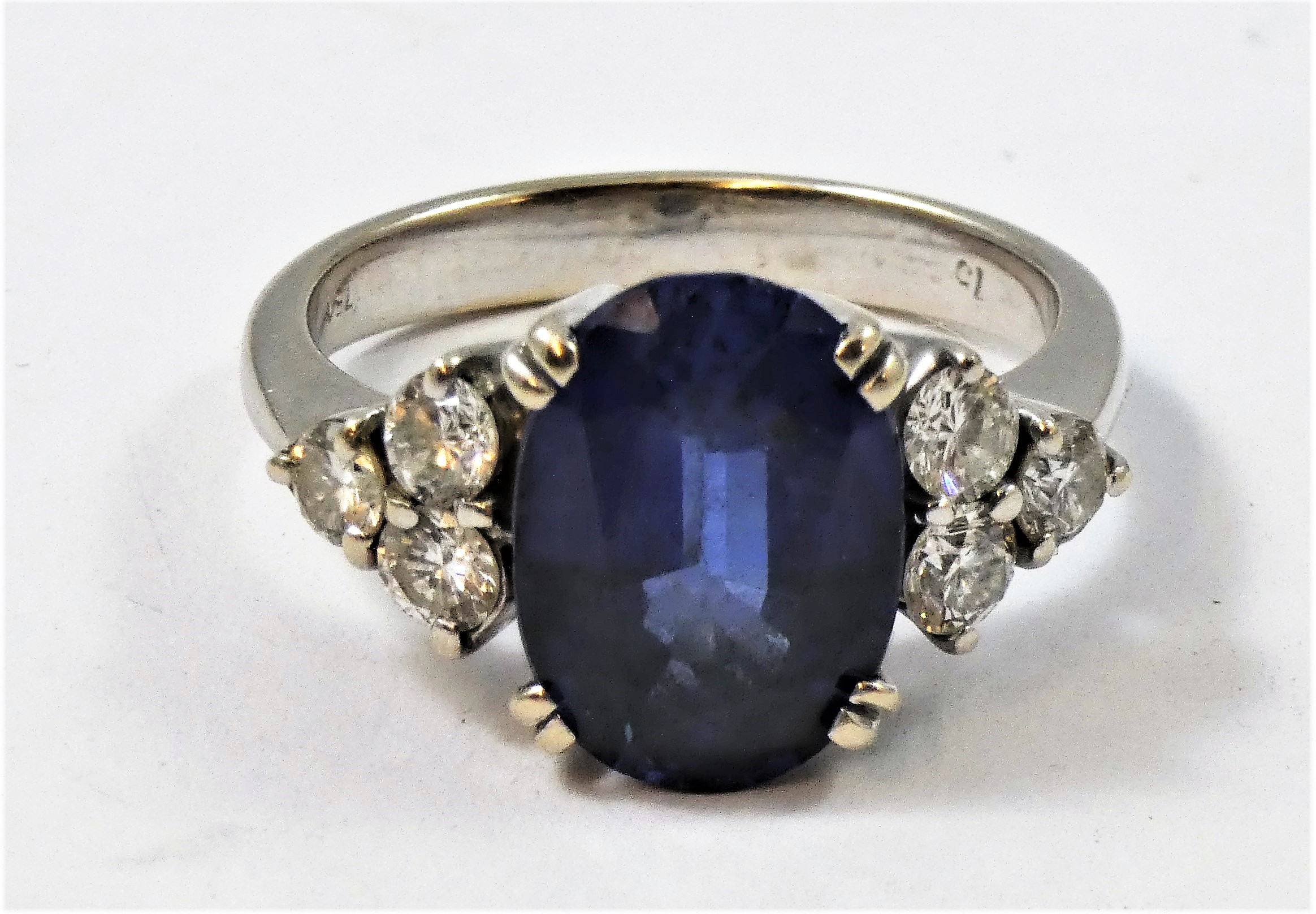 An 18ct white gold synthetic sapphire and diamond ring, claw set with an oval mixed cut stone, - Image 2 of 3