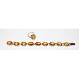 A Scottish 9ct gold citrine bracelet, by DJE, Edinburgh 1973, composed of nine collet set oval mixed