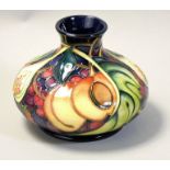 A Moorcroft 'Queens Choice' pattern tube line decorated squat vase, painted by Wendy Mason,