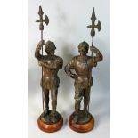 A pair of spelter halberdiers on oak bases, height 43cm (2).