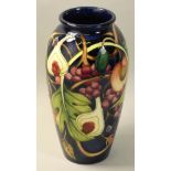 A Moorcroft 'Queens Choice' pattern tube line decorated vase, designed by Rachel Bishop, impressed