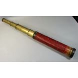 A Dollond of London four drawer brass telescope, lacking leather cover, length extended 142cm.