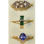 A 9ct gold blue and white sapphire ring, size N1/2, a 9ct gold emerald and diamond ring, size N1/
