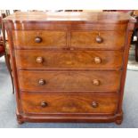 A Victorian stepped bow front chest of two short over three long graduated drawers, bun handles