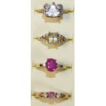 A 9ct gold ruby set ring, size N 1/2, two 9ct gold gem set rings, combined weight 7.4 gms and a