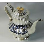 A William IV silver coffee pot, by George Burrows II, London 1826, of lobed baluster form, raised on