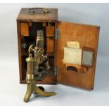 An early 20th century cased E Leitz Wetzlar microscope, with gilt and black lacquer finish, the case