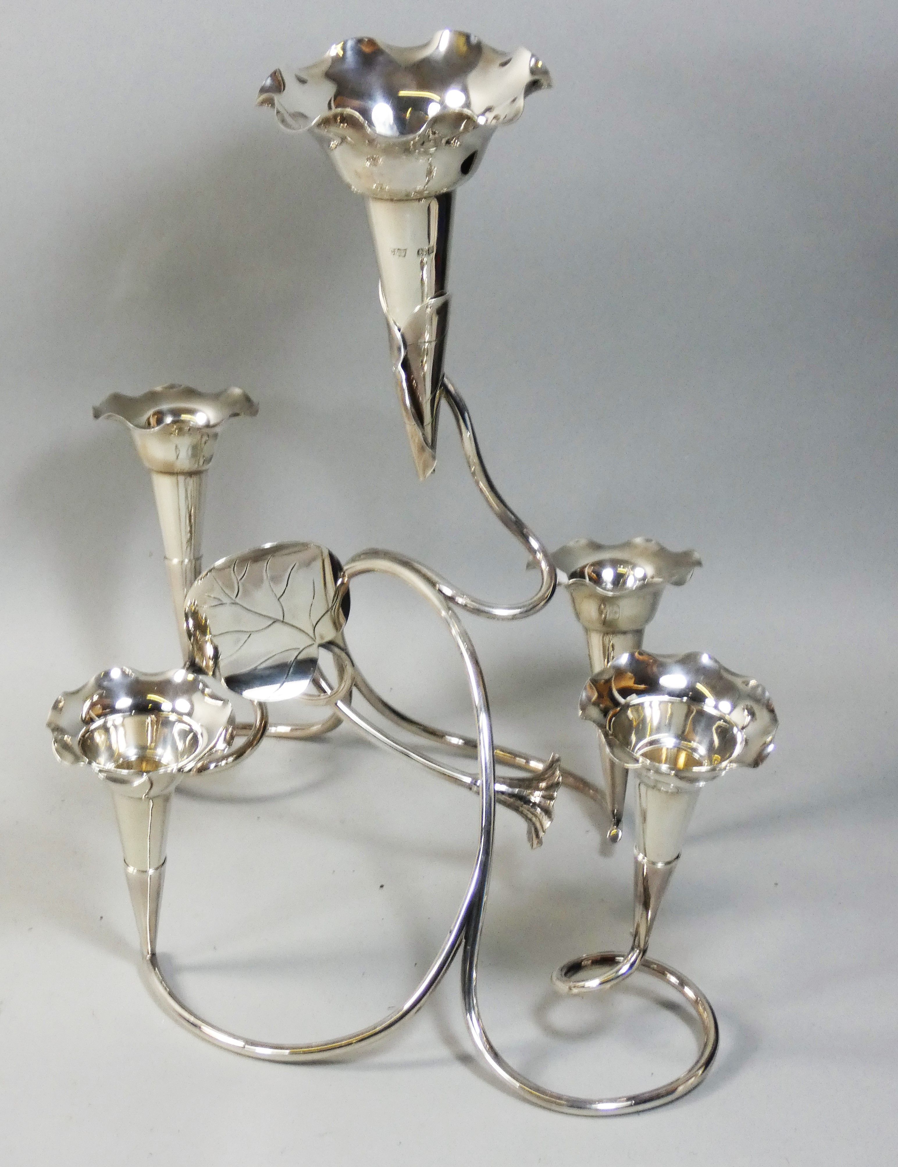 An Edwardian silver epergne by Cropp & Farr Birmingham 1907, composed of five flower vases in a