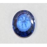 An oval mixed cut loose Tanzanite stone, 13 x 11 mm.