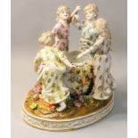 A Meissen 20th century porcelain figure group, modelled as four girls dancing in a circle around a