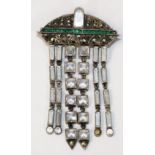 An Art Deco sterling silver and paste Art Deco tassel brooch, set with green a clear paste stones