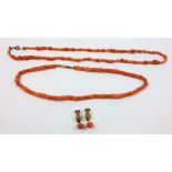 A Victorian coral bead single row necklace, another smaller and a pair of earrings, weight of