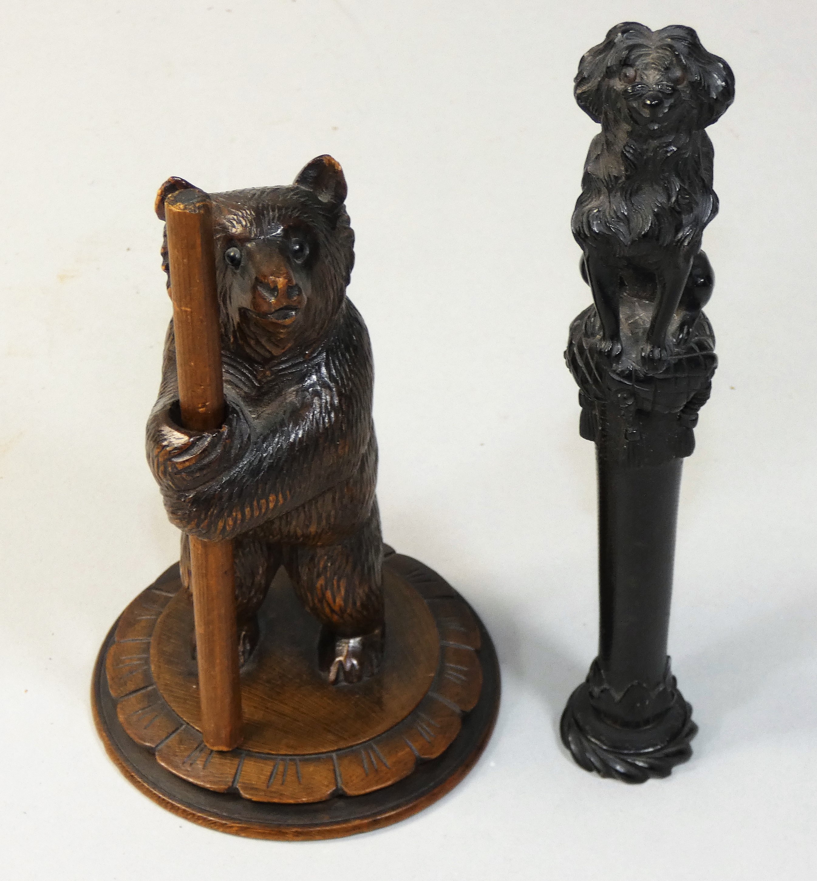 A 19th century French ebonised handle, carved in the form of a King Charles Spaniel upon a