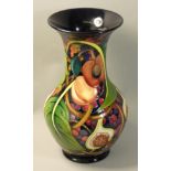 A large Moorcroft 'Queens Choice' pattern tube line decorated vase, of baluster form with polychrome