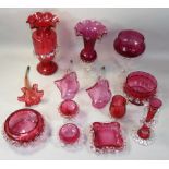 An assortment of Victorian cranberry glassware, to include a trumpet vase with clear glass spiral