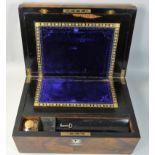 A Victorian rosewood writing slope, opening to reveal a fitted interior, mother of pearl