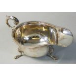 A silver sauce boat, Birmingham 1935, with gadrooned border, length 15cm, 3 oz.