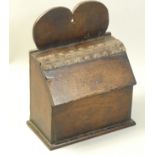 An early 19th century oak country made salt box, with heart shaped bracket and leather hinge, height