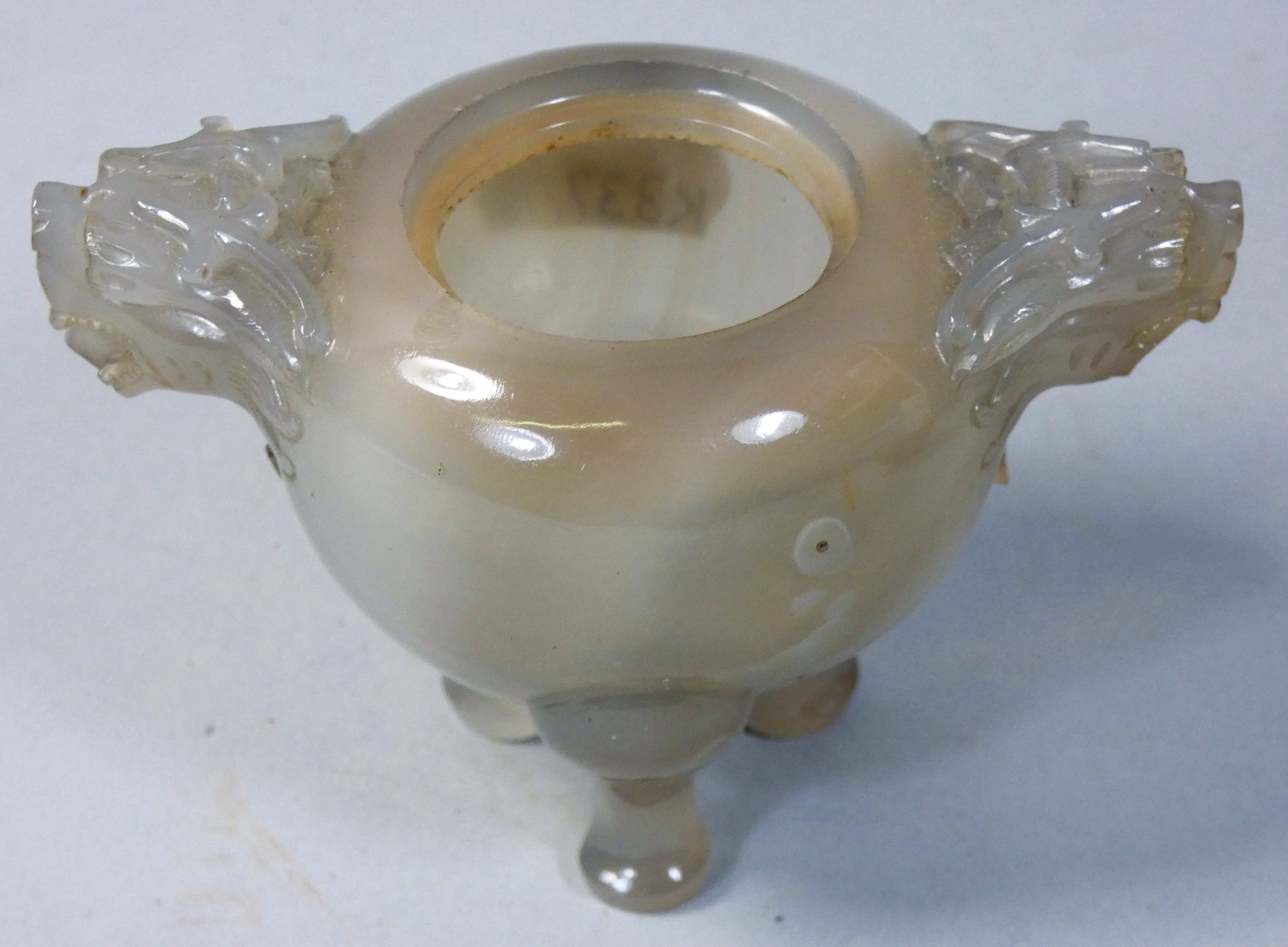 A Chinese carved jade pot, Quin Dynasty, with stylised dragon handles, raised on three pad feet, - Image 2 of 5