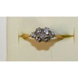 An 18ct gold seven stone diamond ring, panel set with brilliant cut stones, total weight