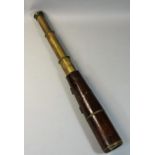 A 19th century brass three drawer telescope, with leather cover, length extended 88cm.