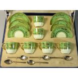 An Art Deco Cauldon china cased set, comprising set of six green and gilt demitasse coffee cups