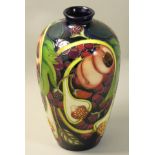 A Moorcroft 'Queens Choice' pattern tube line decorated vase, designed by Emma Bossons, impressed