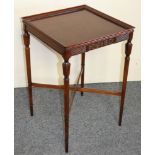 A mahogany square side table, with moulded border and reeded frieze, raised on tapering legs with