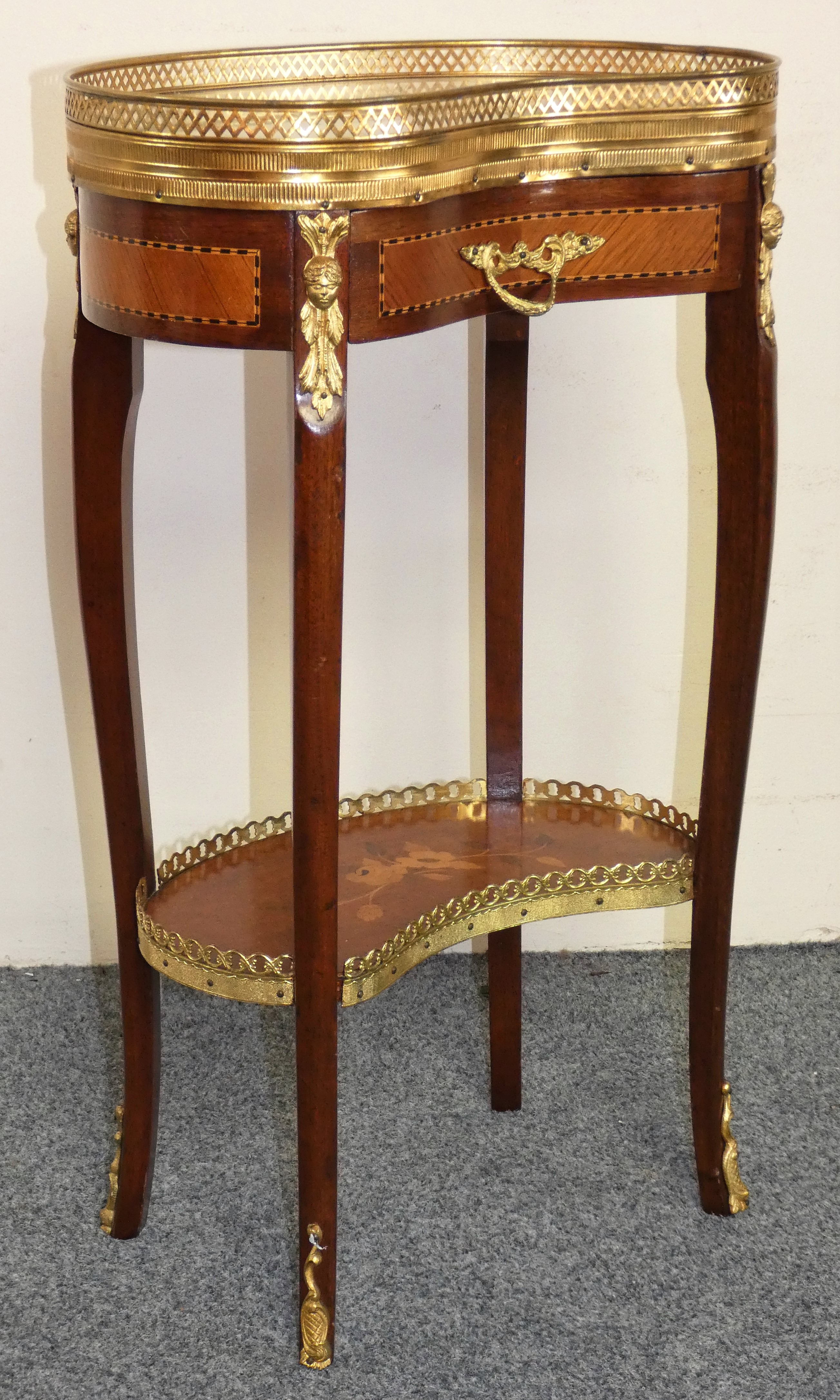 A French style kidney shape marble and mahogany side table, with brass gallery, frieze drawer,