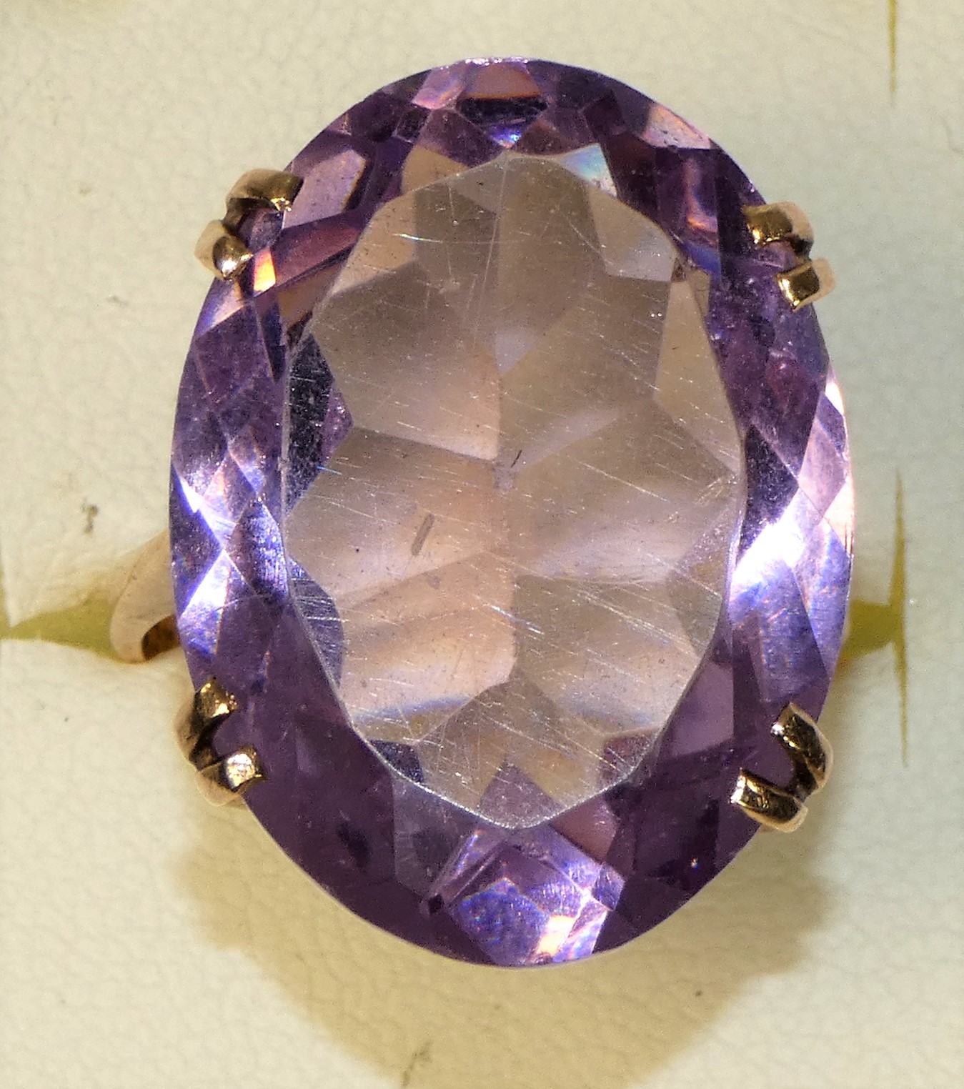 A 9ct rose gold mounted amethyst ring, four claw set with on oval mixed cut stone, 25 x 20 mm,