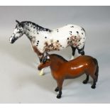 A Beswick Dartmoor pony 'Warlord', height 16cm, together with a Royal Doulton Appaloosa, height 20.