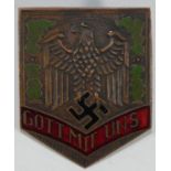 A German enamel 'Gott Mit Uns' metal badge, of shield shape, the reverse stamped GES GESCH, nut