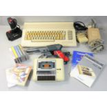 A boxed Commodore 64C 'Light Fantastic' computer and cassette unit, with various games, toolbox