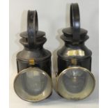 A pair of railway signalling lamps, one by A. H. Castledine, the other L.M.S. 45393 (2).