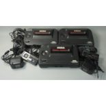 Three Sega Master System II game consoles, together with three control pads and two AC mains