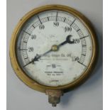 A brass pressure gauge by Budenberg Gauge Co. Ltd, No. 1387160, diameter 10cm.