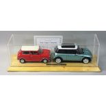 Kyosho Mini Cooper collection, scale 1:18 Morris Mini Cooper Mk 1, together with a 2006 Mini Cooper,