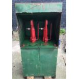 A vintage oil dispenser cabinet, painted in Castrol colours, the sliding door opening to reveal