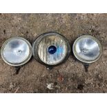 A Speed master fog lamp, removed from a 1952 Jowett Jupiter, and two other lamps.